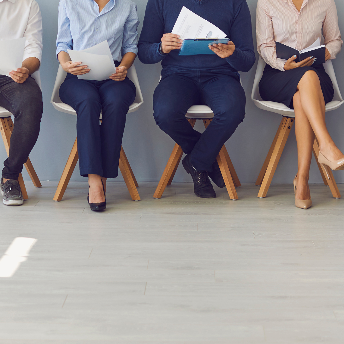 people lining up for change management job interviews