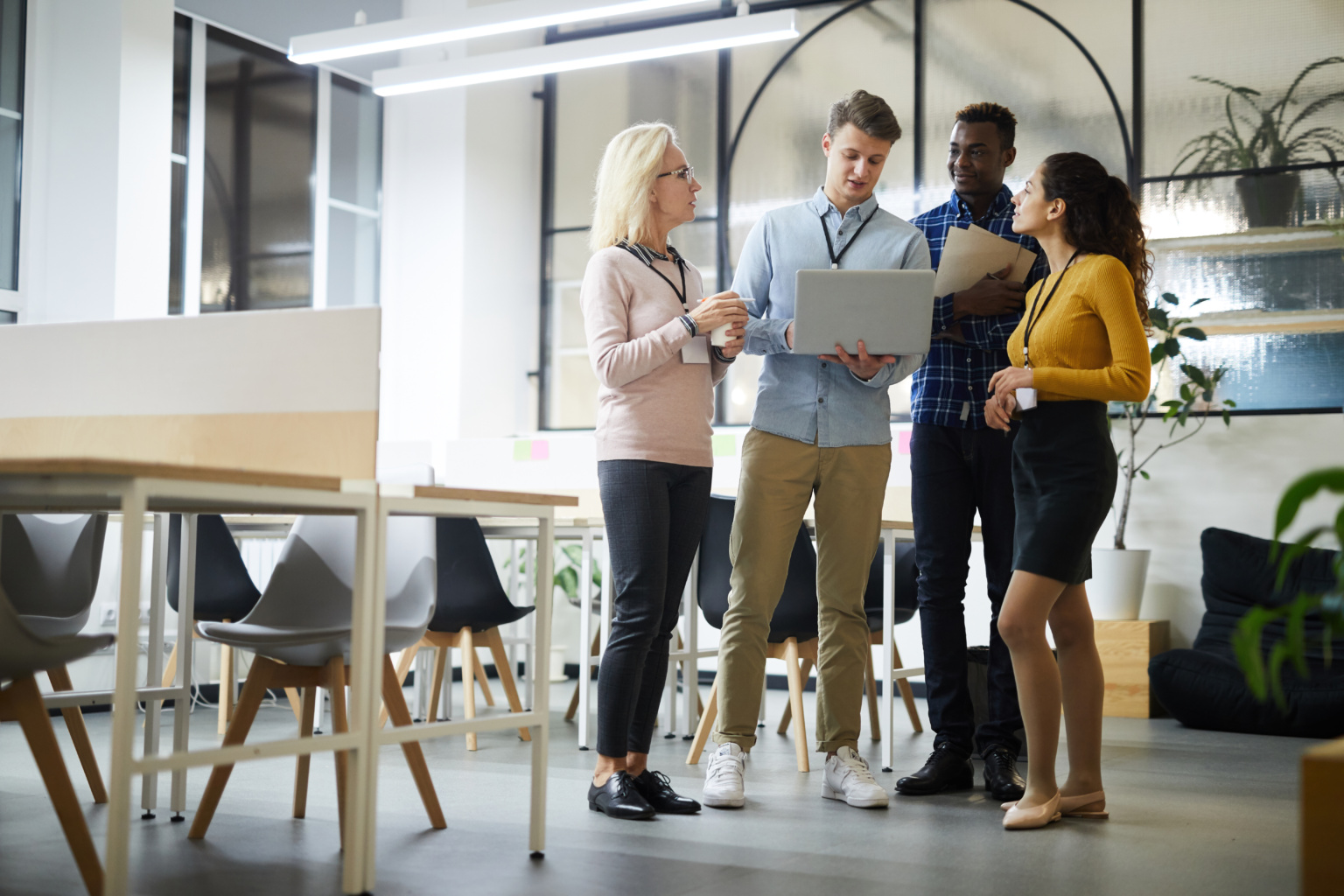 Colleagues Analyzing Online Data In Coworking Space